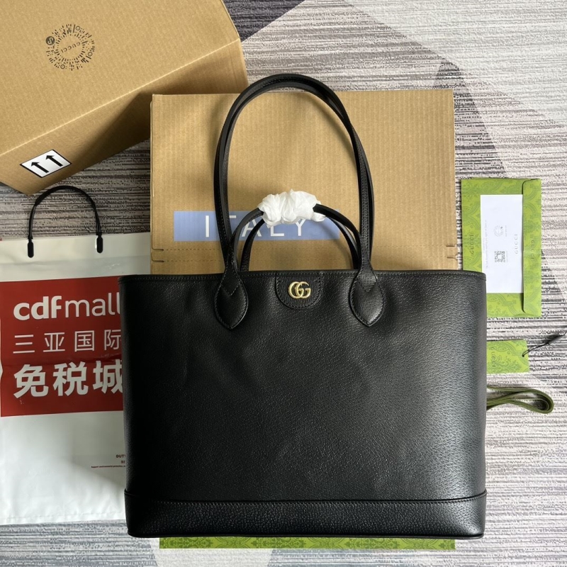 G*u*i shopping bags